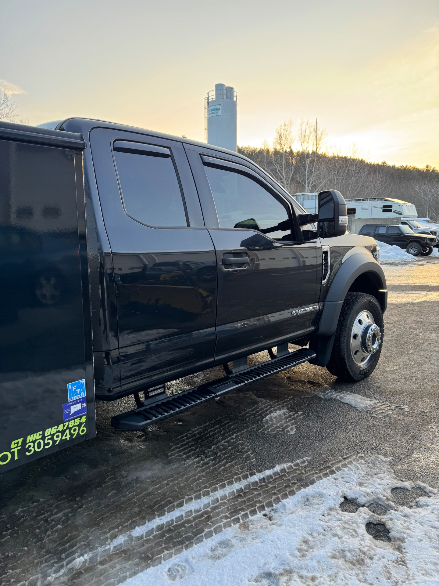 Cayne's Power Washing truck parked beside snow after a Connecticut winter storm